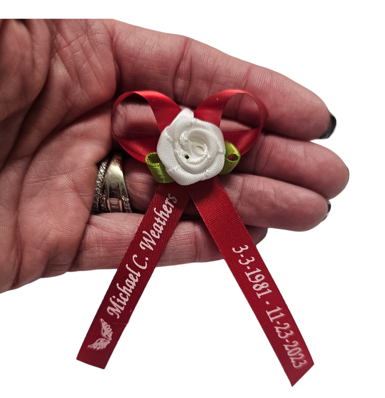 personalized ribbons with embellishment and pins on the back